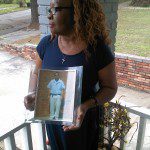 Dinah Robinson with Photo of Her son, Aaron Johnson